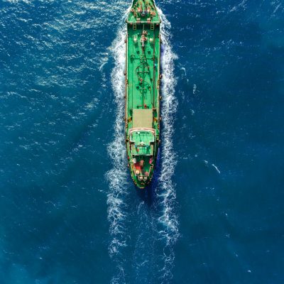 Aerial top view Oil ship tanker full speed transport oil or fuel from refinery on the sea.
